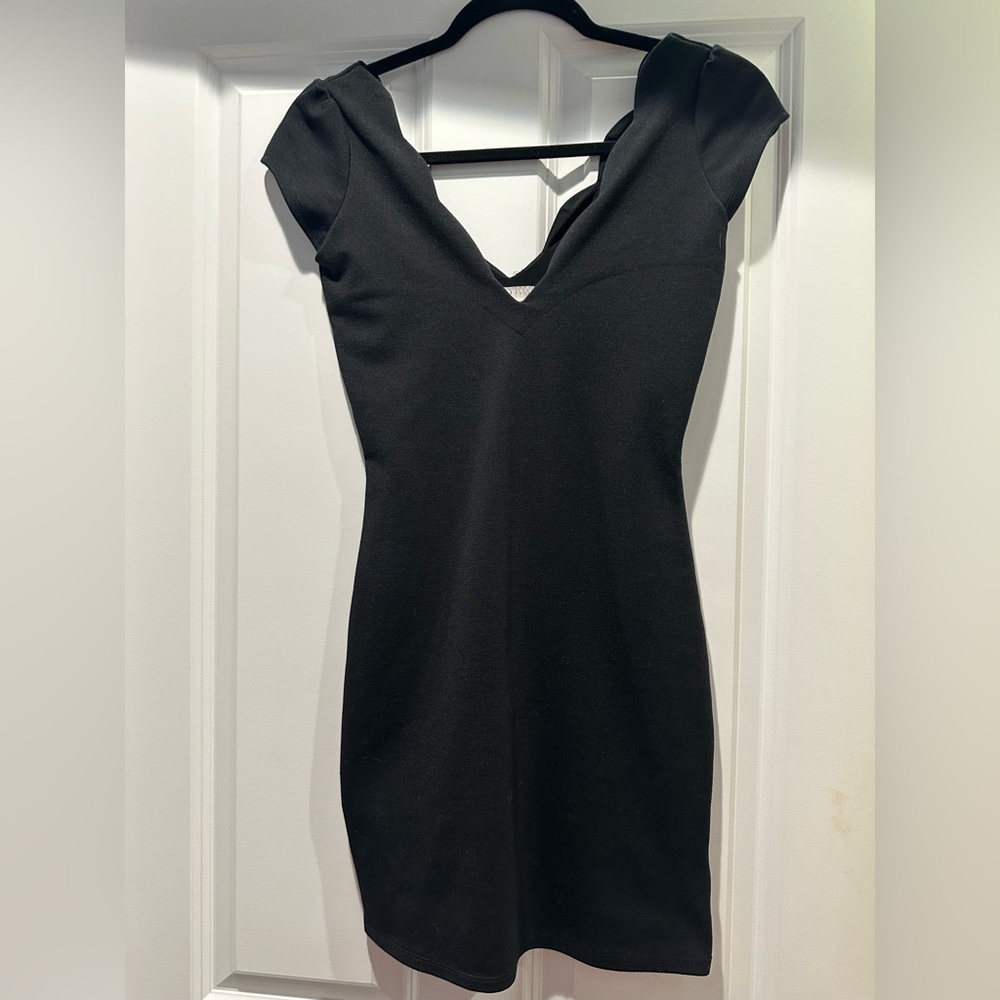 Scalloped neck black mini dress
